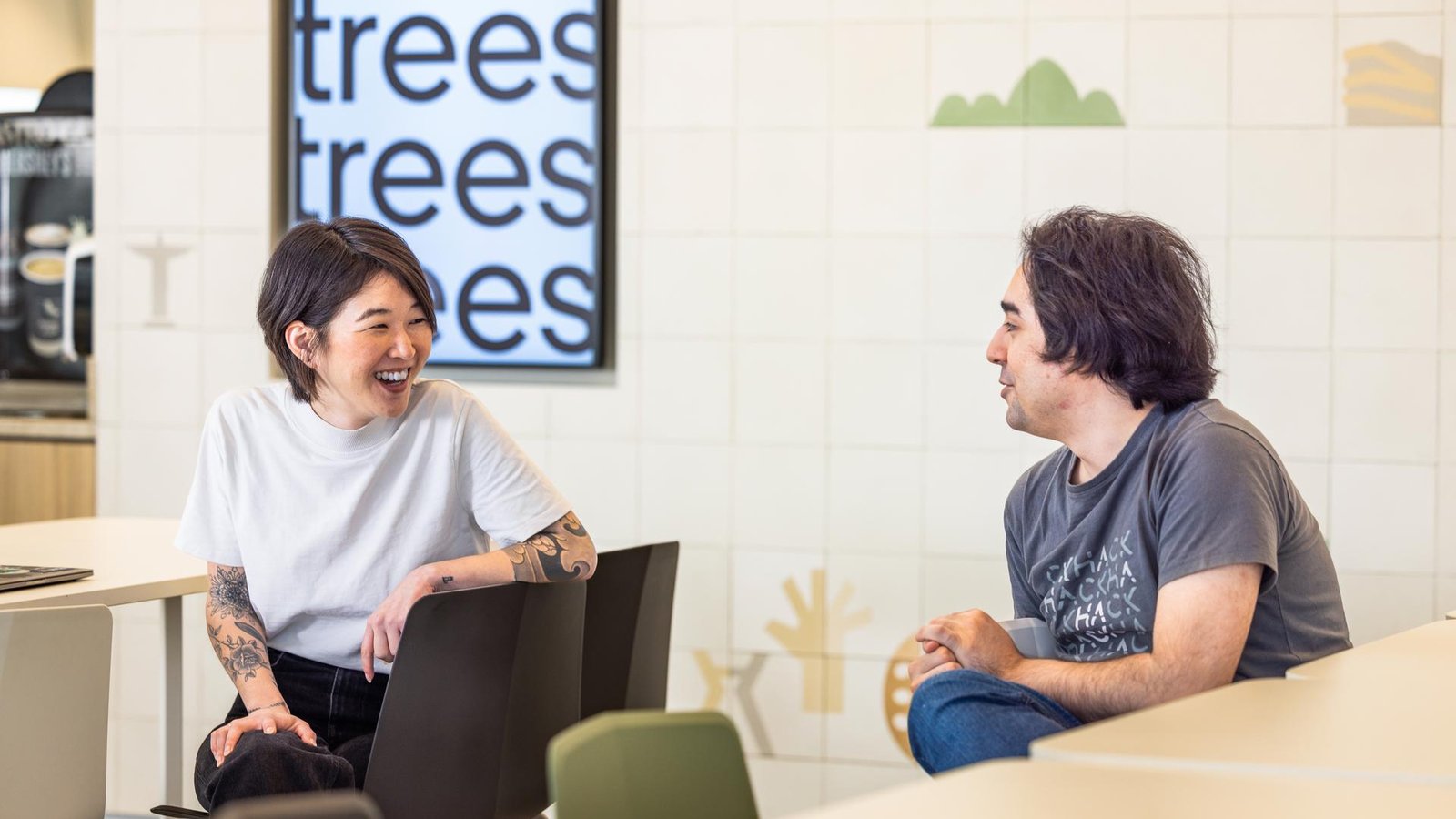 a person and person sitting in chairs