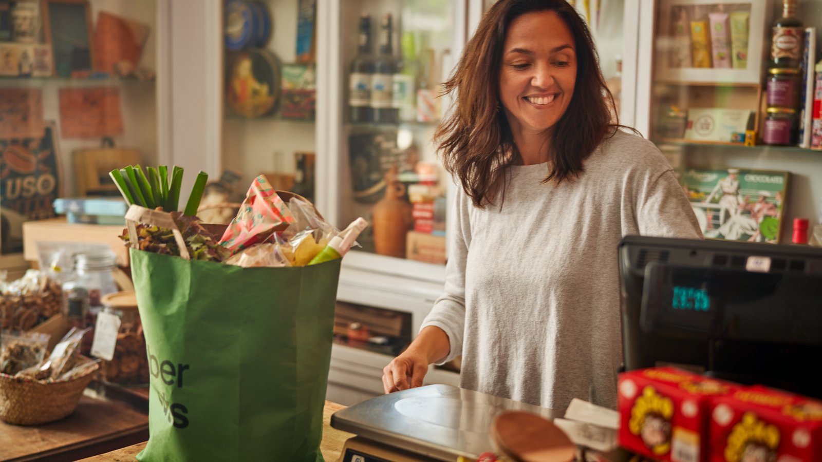a person standing at a cash register