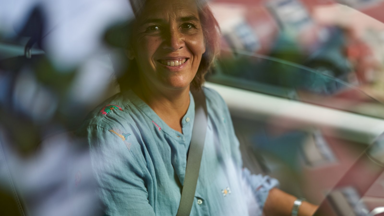 a person smiling in a car