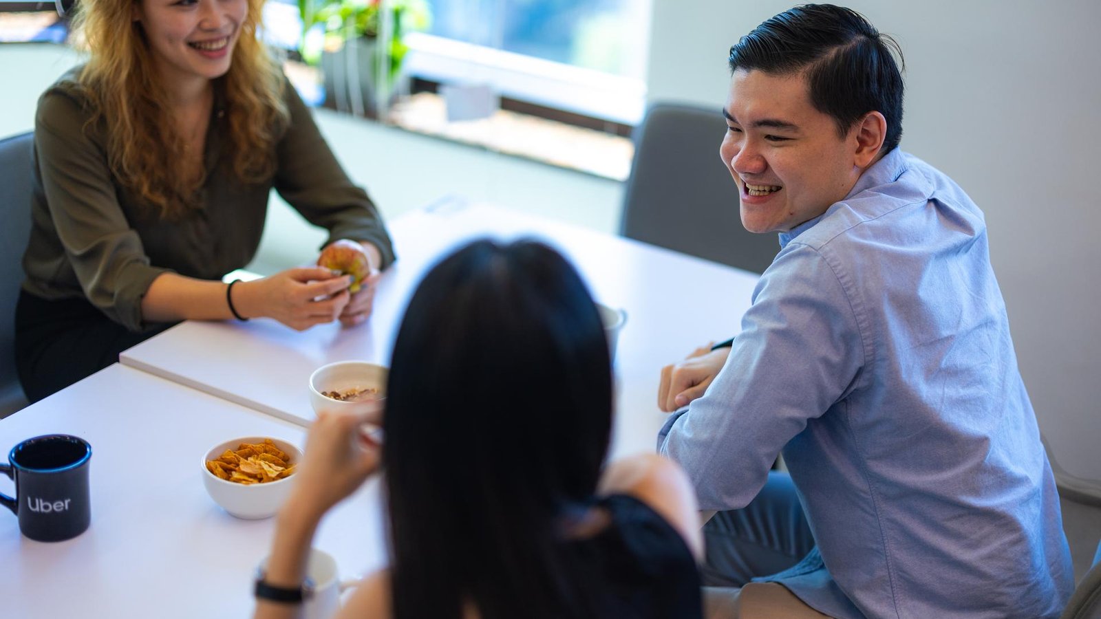 a group of people sitting at a table