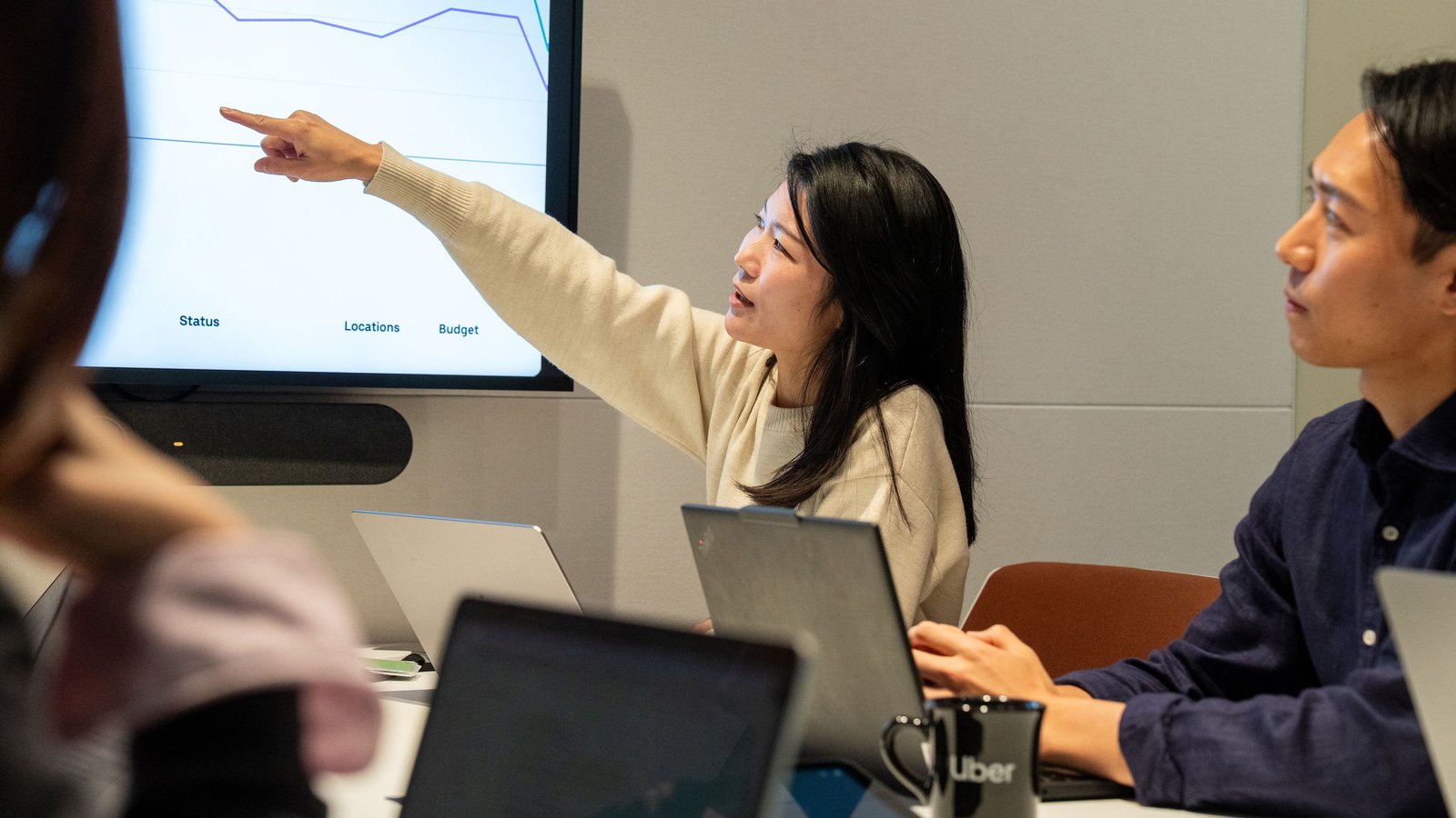 a person pointing at a screen
