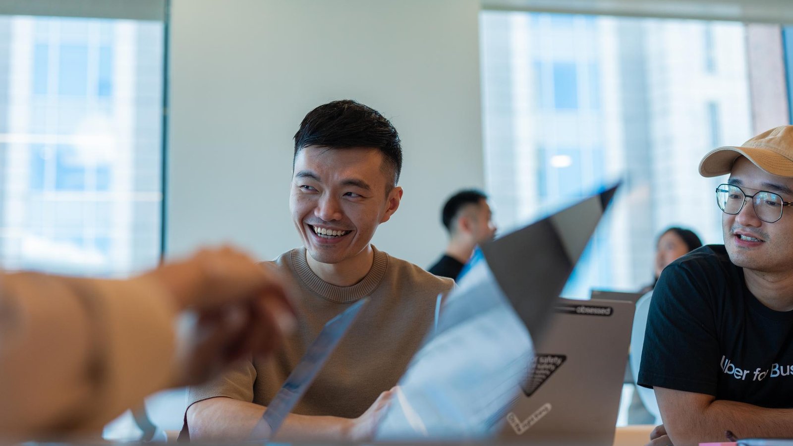 a person smiling at a table