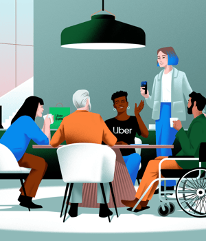 a person standing at a table with people sitting around it