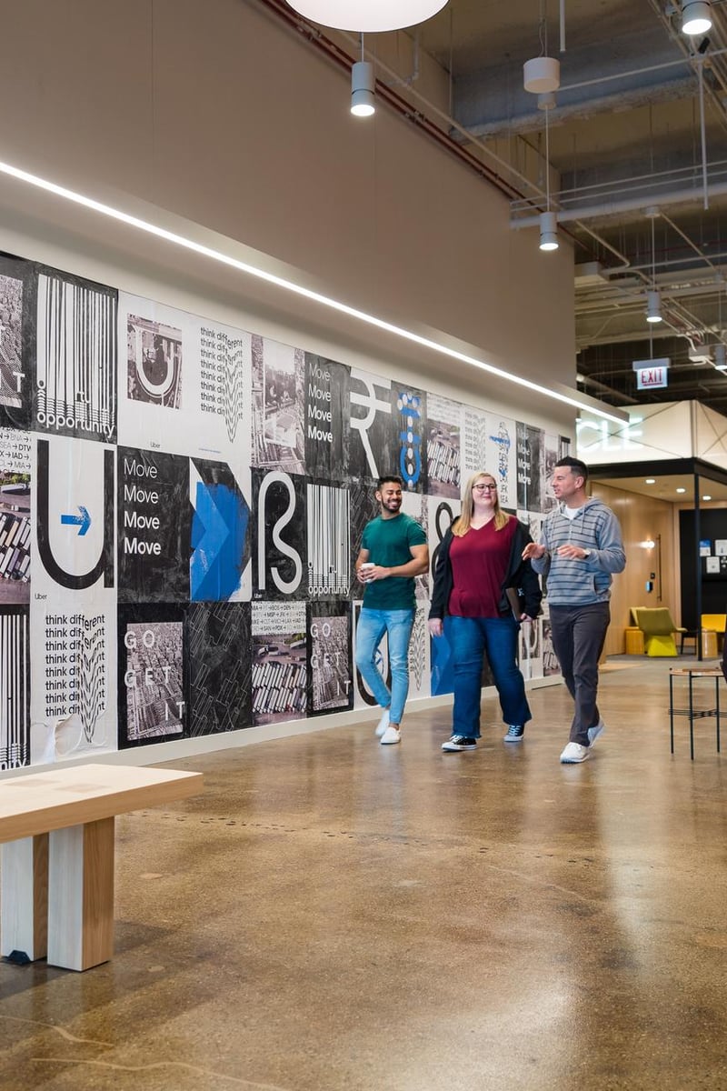 a group of people walking in a building