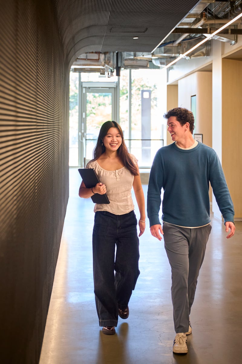 a person and person walking down a hallway