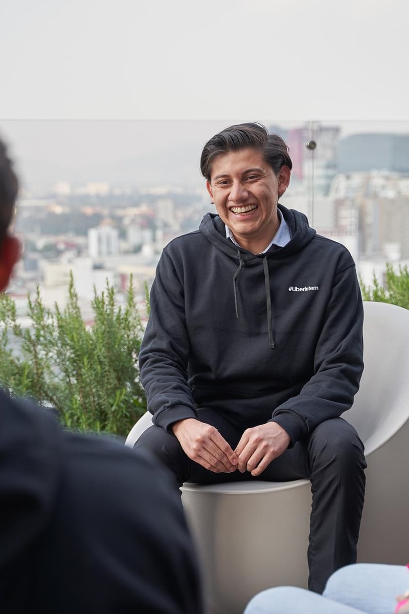 a person sitting in a chair with a city in the background