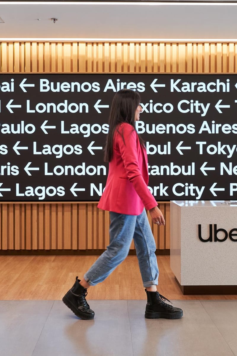 a person walking in front of a sign