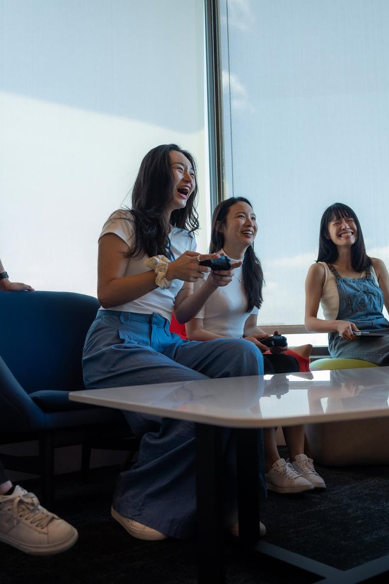 a group of people laughing while playing video games