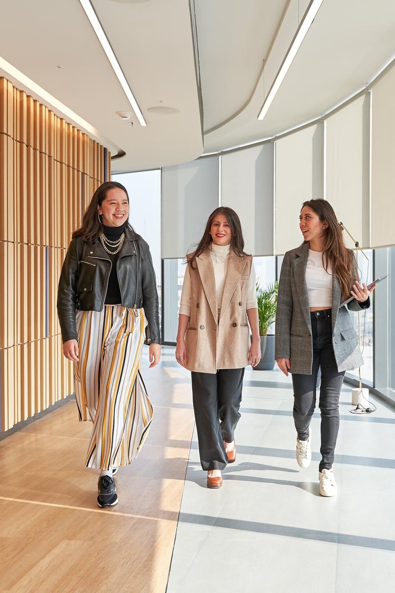 a group of women walking in a hallway