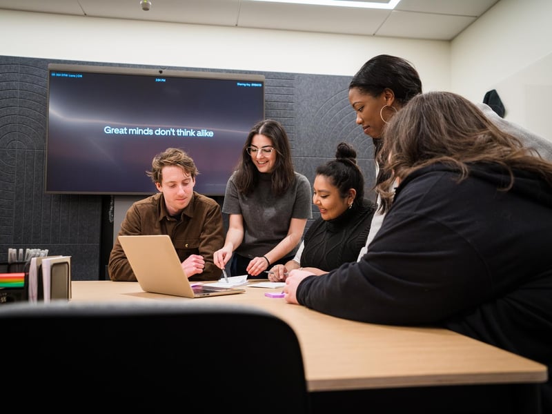 a group of people around a table