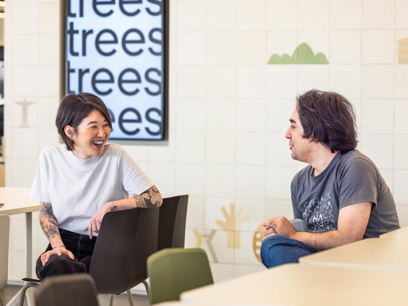 a person and person sitting in chairs