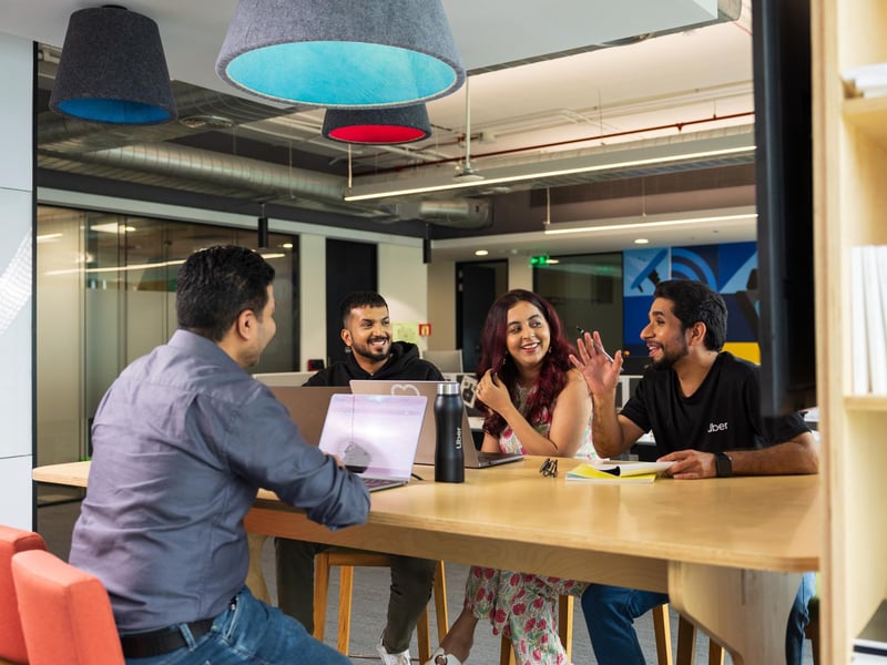 a group of people sitting around a table