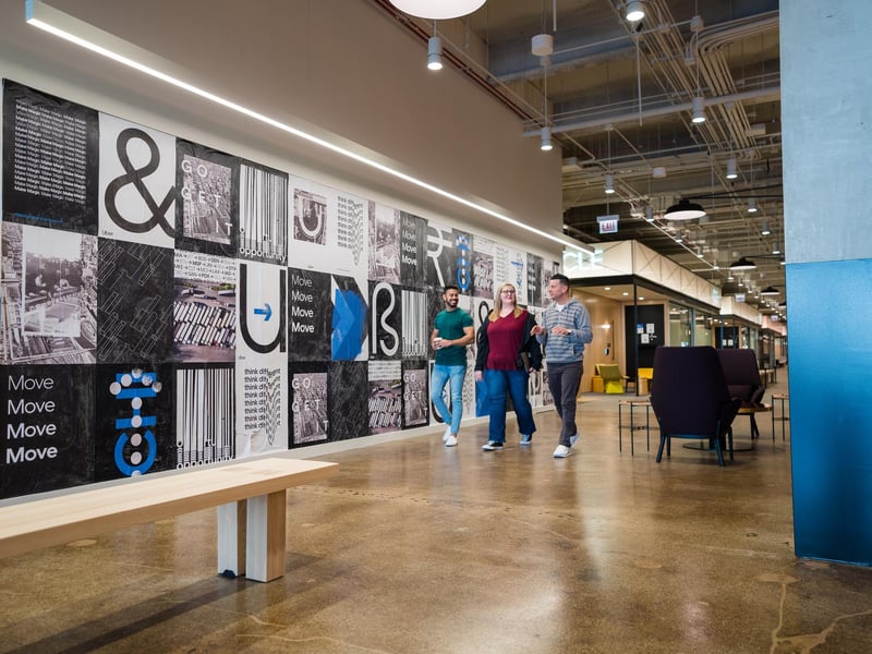 a group of people walking in a building