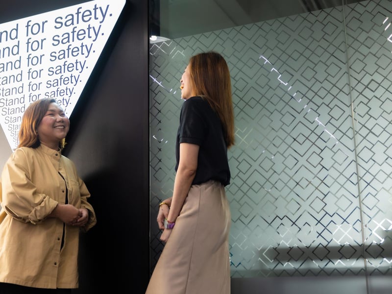 a person standing next to another person