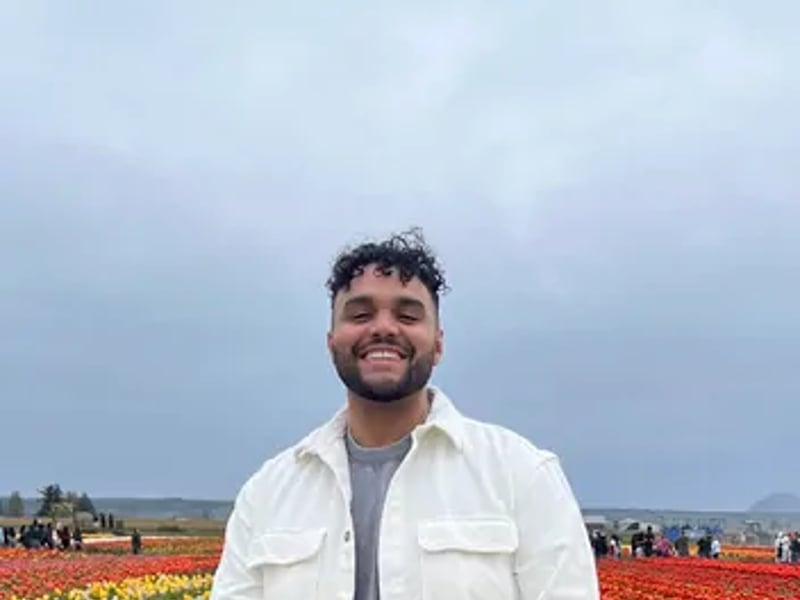 a person standing in a field of flowers