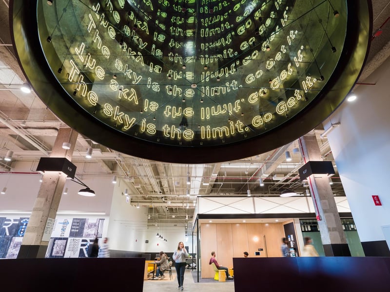 a large circular glass structure with text on it