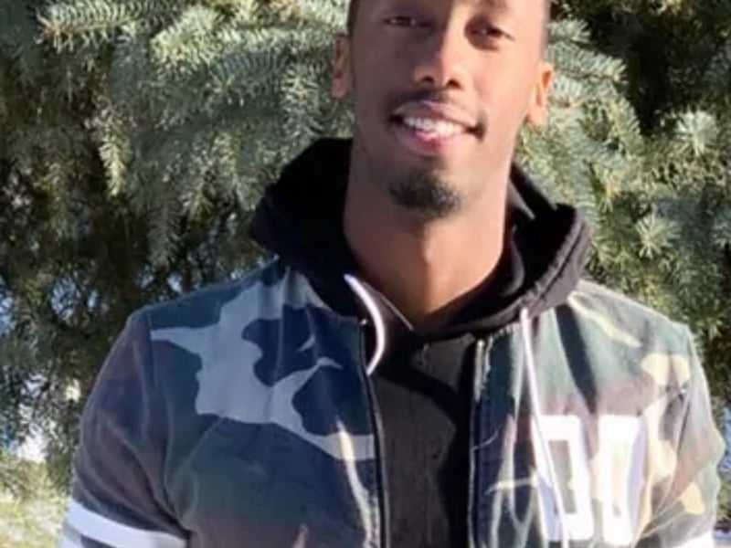 a person in a camouflage jacket