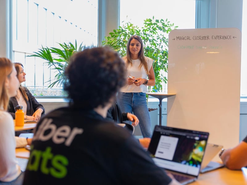 a person standing in front of a whiteboard