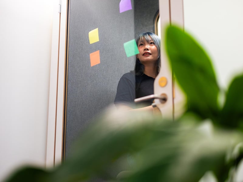 a person looking at a glass door