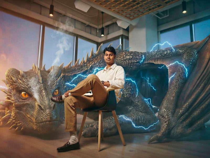a person sitting in a chair next to a dragon