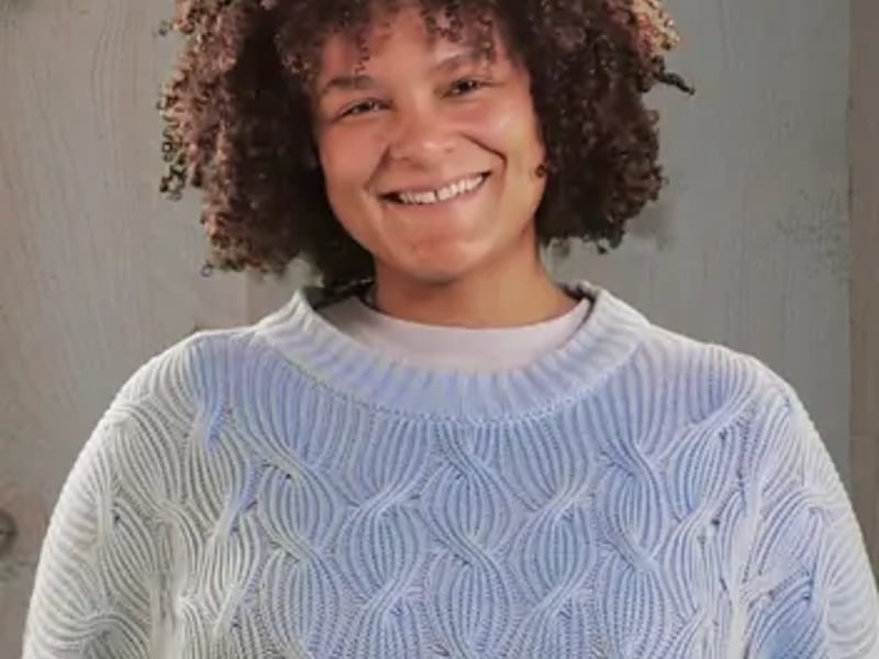 a person smiling at the camera