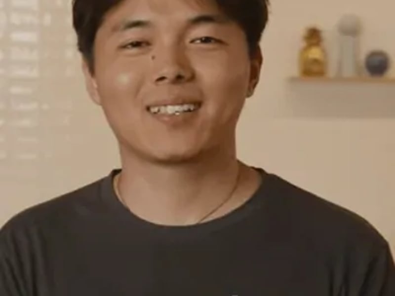 a person smiling at the camera