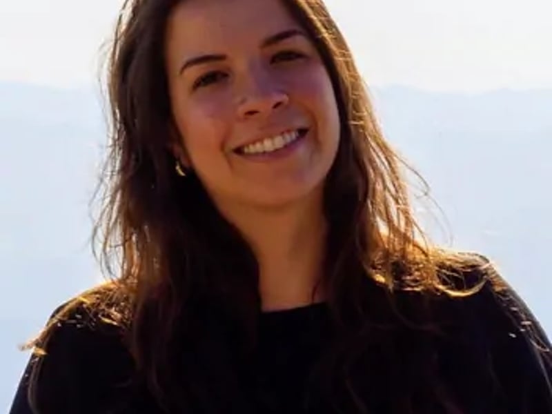 a person smiling at the camera