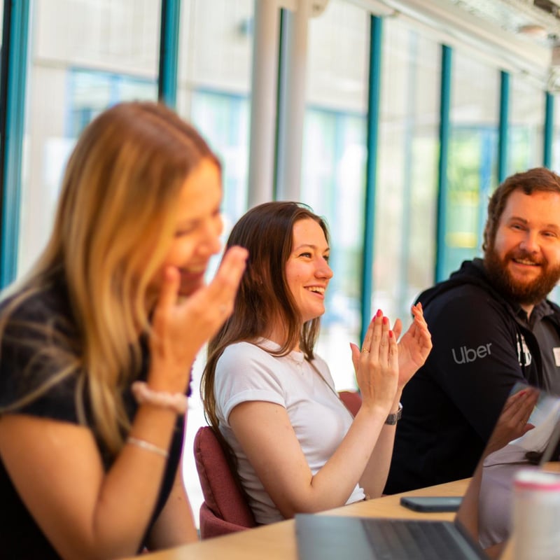 a group of people clapping