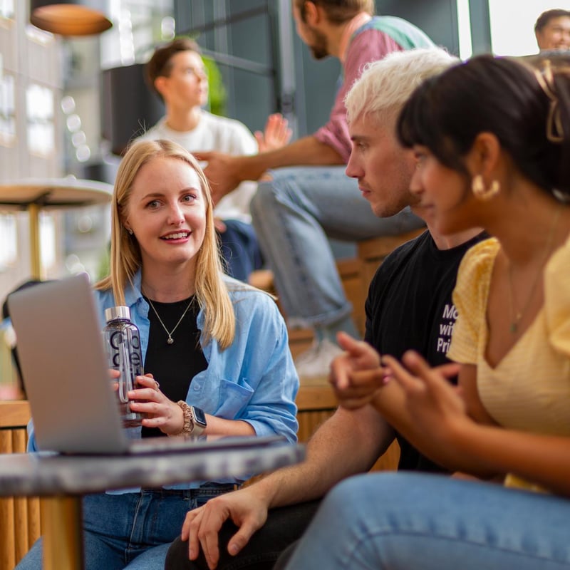 a group of people sitting around a table