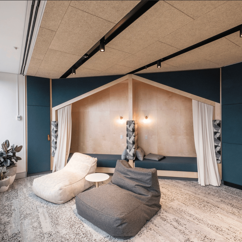 a room with a couch and chairs