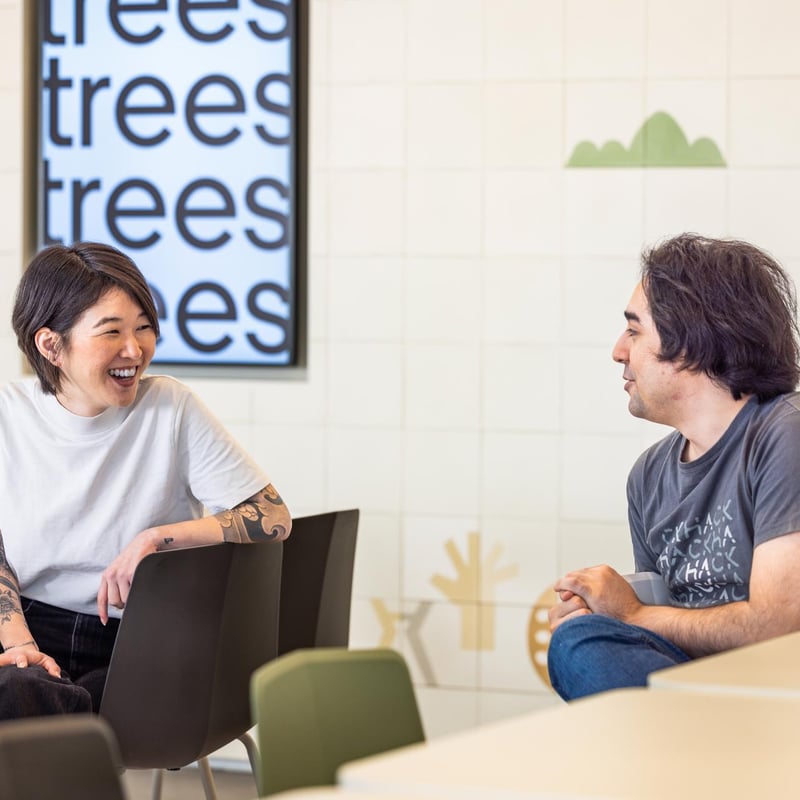 a person and person sitting in chairs