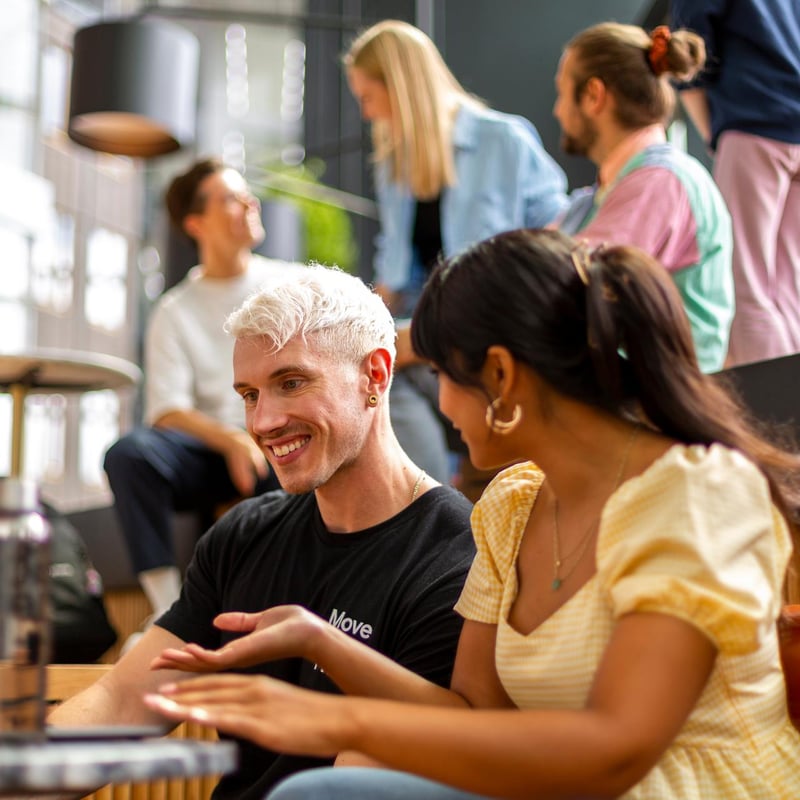 a person and person sitting at a table