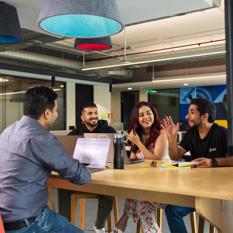 a group of people sitting around a table