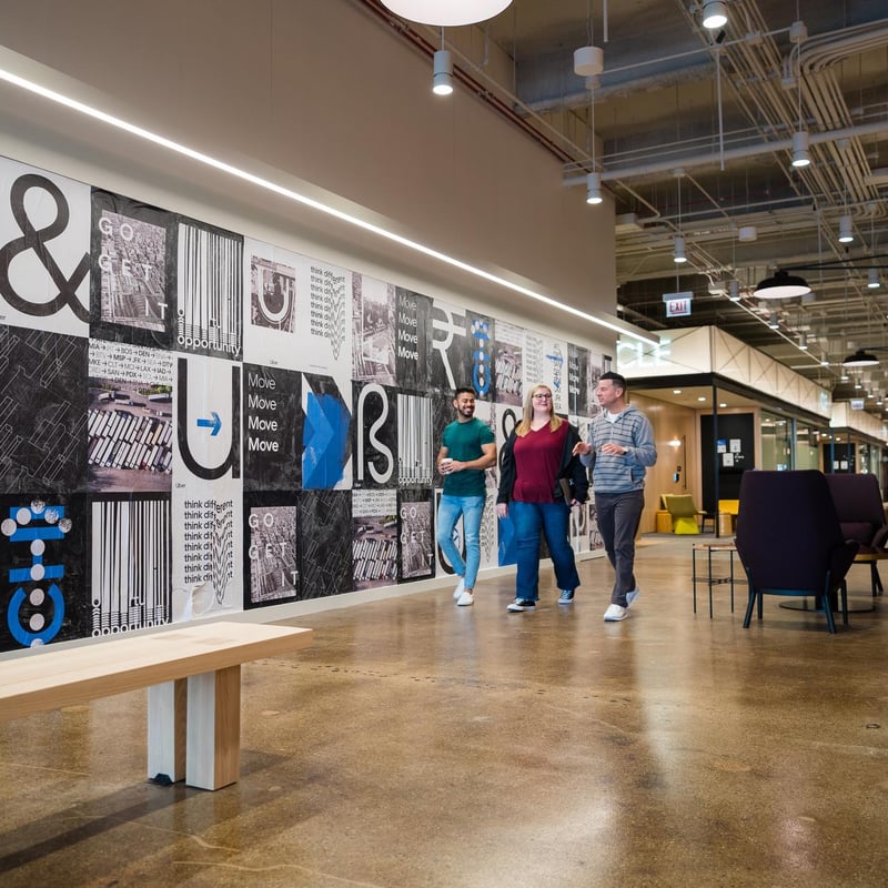 a group of people walking in a building