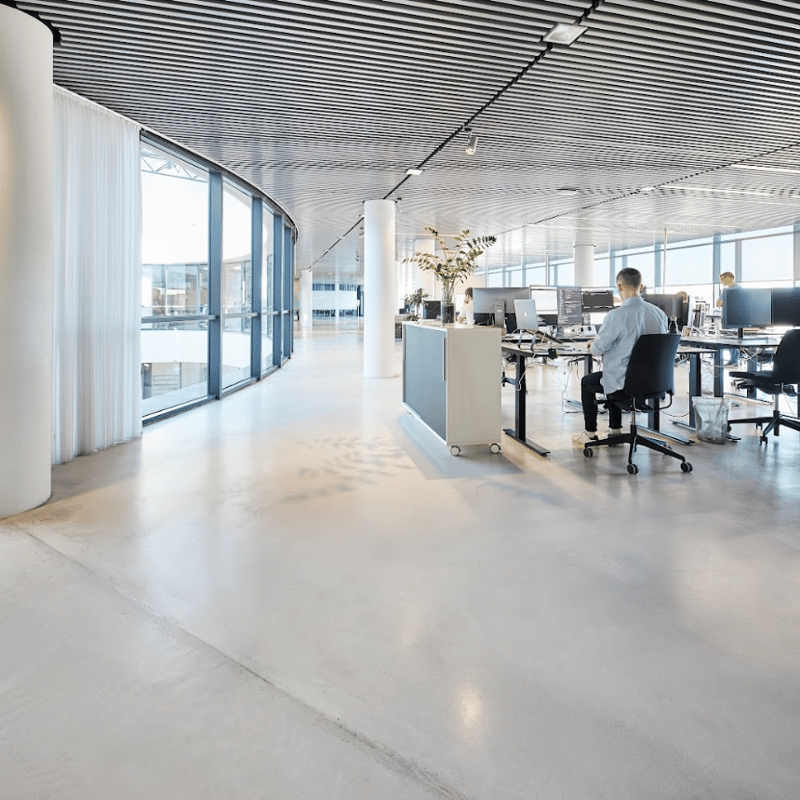 a person sitting at a desk in an office