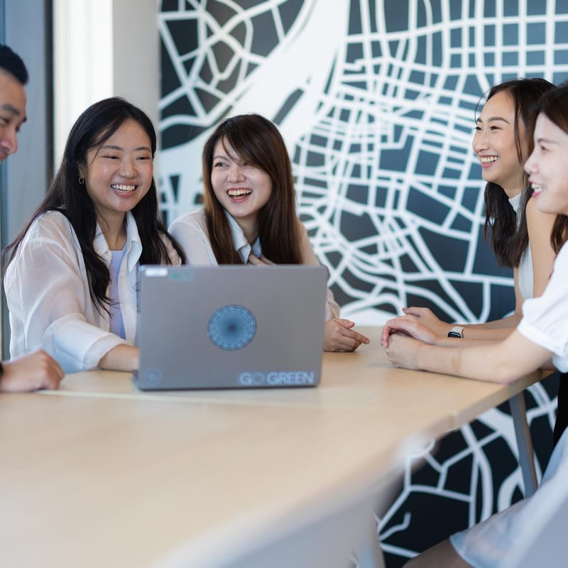 a group of people sitting around a table