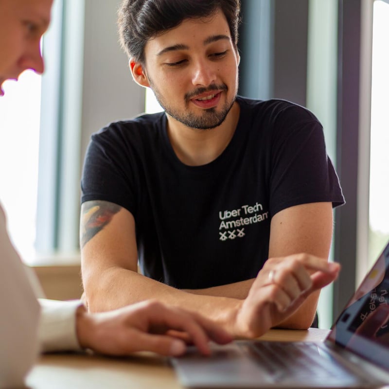 a person looking at a laptop screen