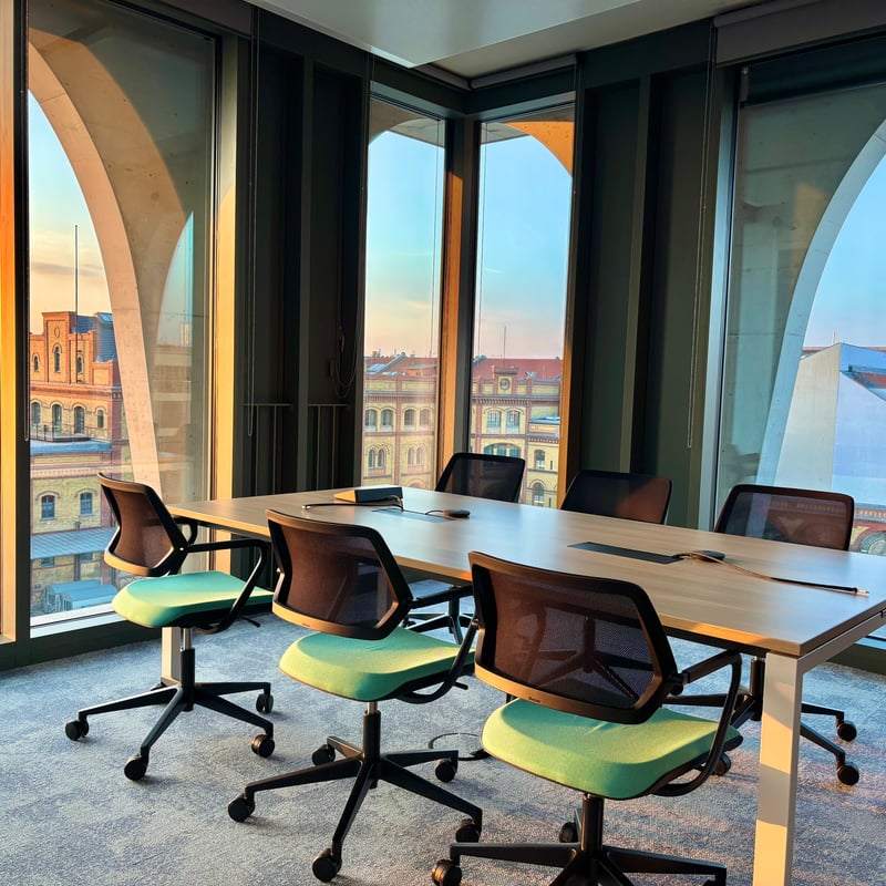 a conference room with a table and chairs
