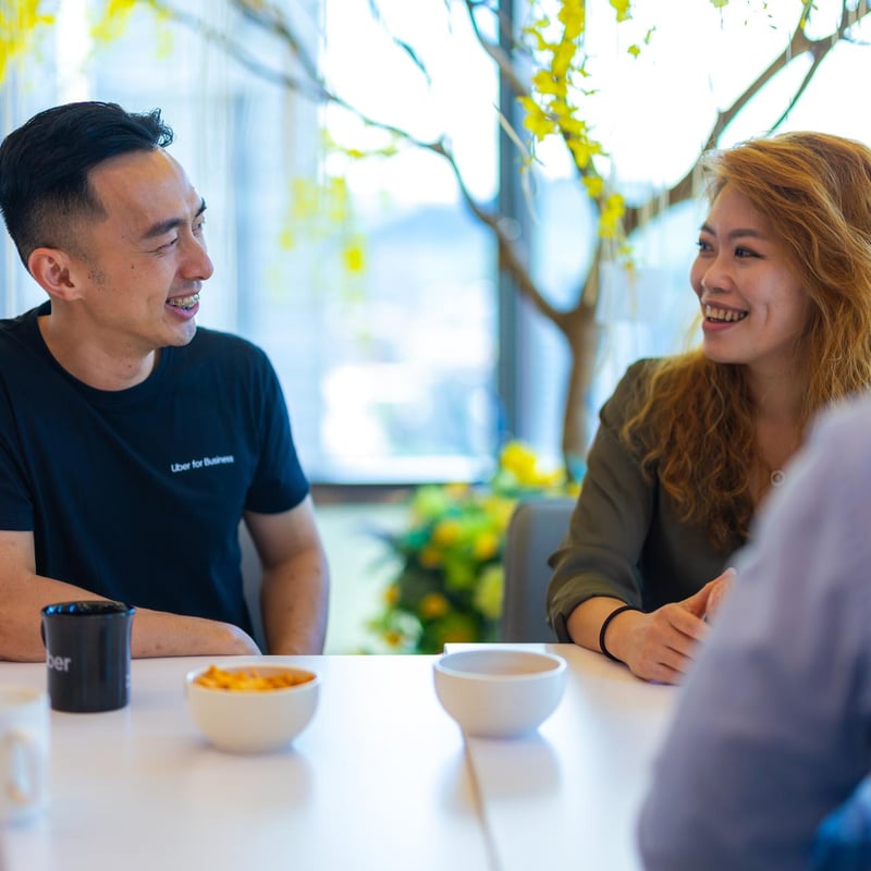 a person and person sitting at a table