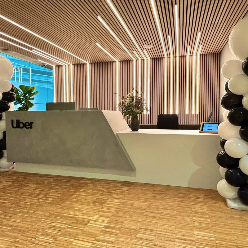 a reception desk with balloons in front of it