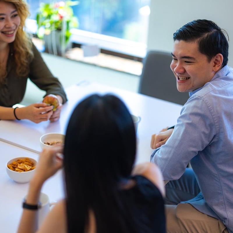 a group of people sitting at a table