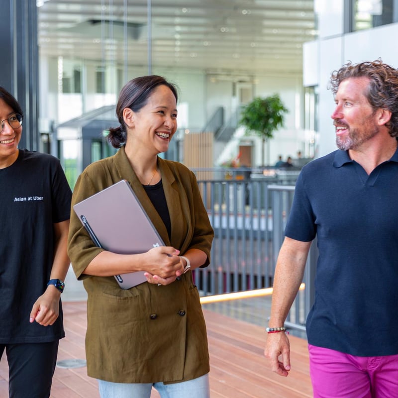 a group of people standing in a building