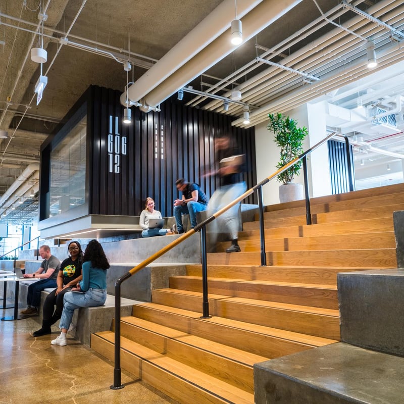 a group of people sitting on stairs