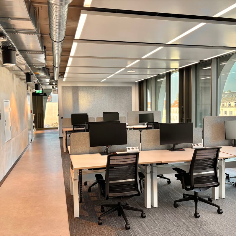 a room with computers and chairs