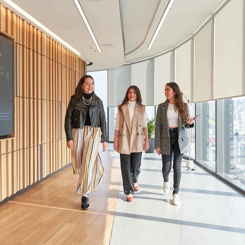 a group of women walking in a hallway