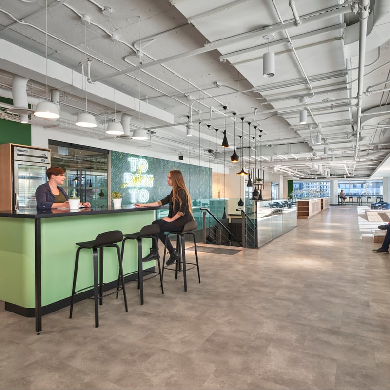 a person sitting at a counter in a building