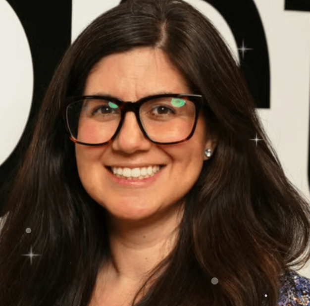 a person with long hair wearing glasses